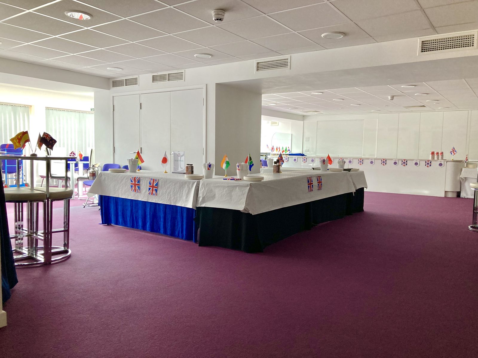The Multifunctional Room set for an event with dressed buffet tables